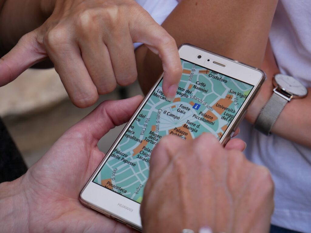 Person using smartphone to search for local businesses on map