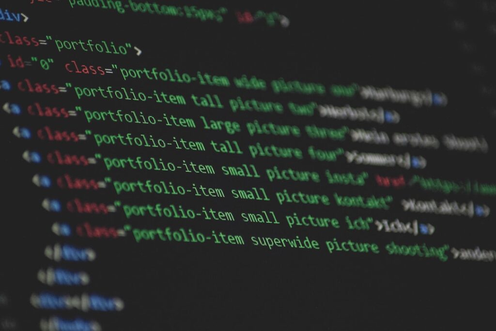 Colorful website code on screen showing technical SEO optimization and web development for search engine improvements