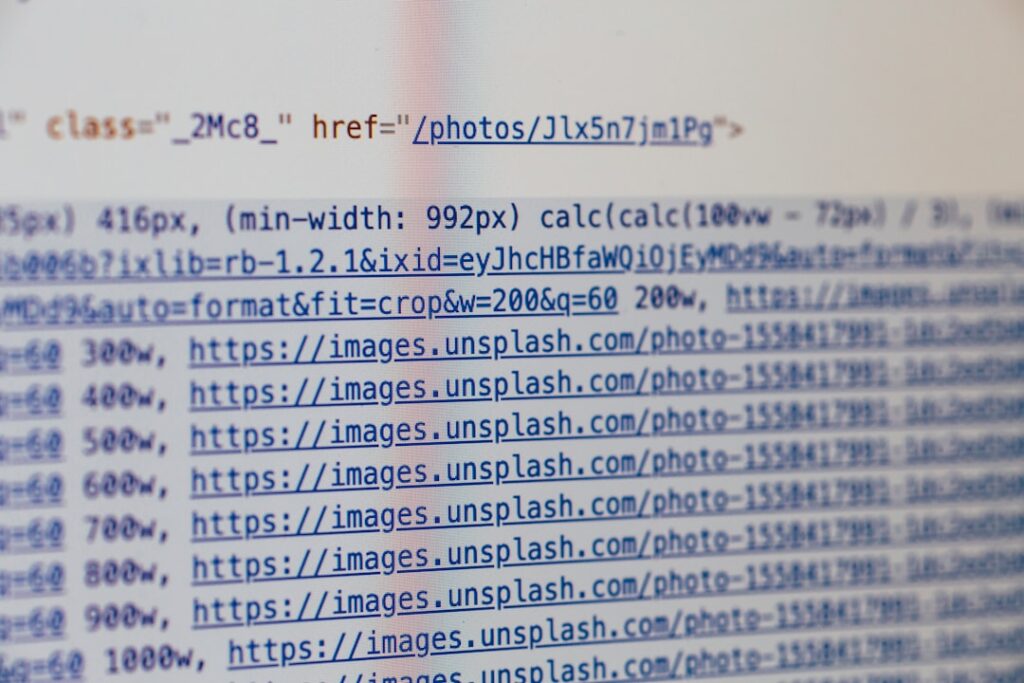 Computer screen showing HTML and CSS code representing technical SEO implementation for multilingual websites