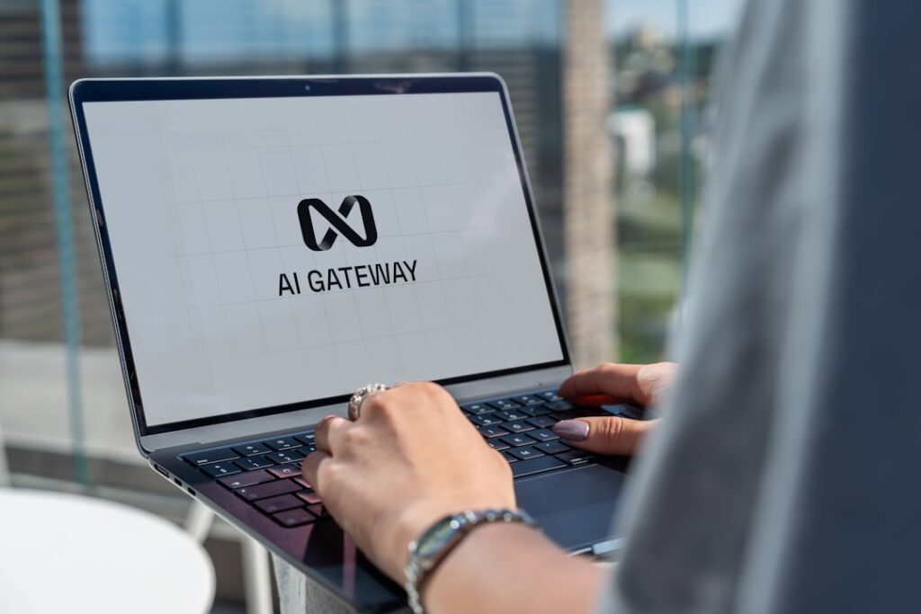 Person working on laptop with AI Gateway technology interface showing artificial intelligence workflow automation