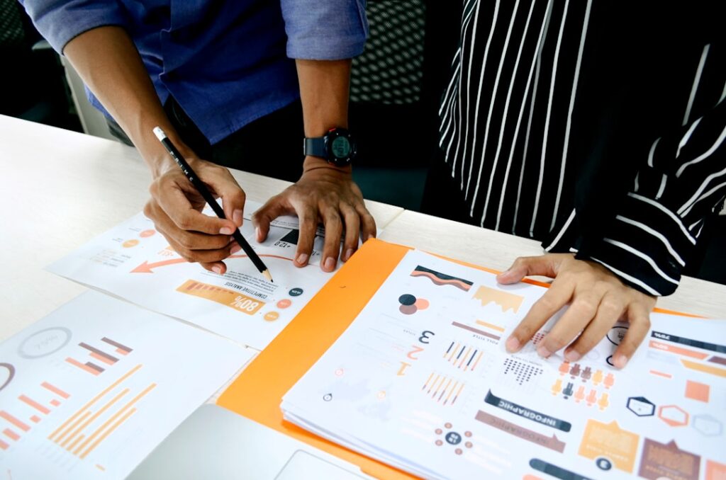 Business team analyzing competitive analysis charts and evaluation matrices for tool selection