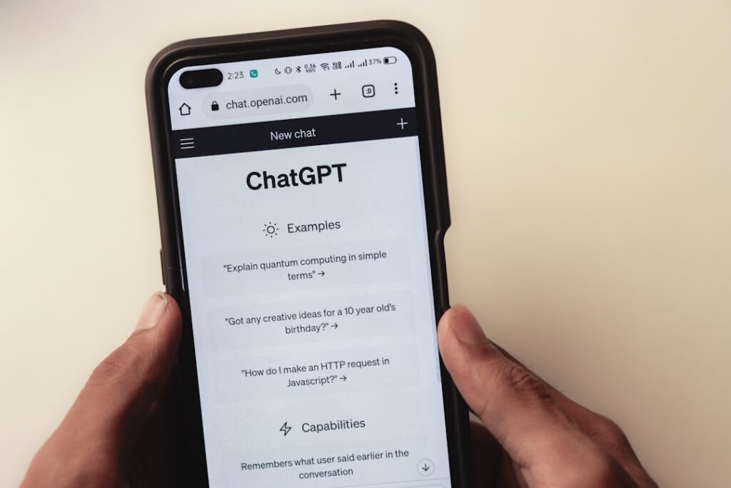 ChatGPT interface on smartphone showing examples and capabilities, illustrating how AI search engines handle conversational queries differently than traditional search