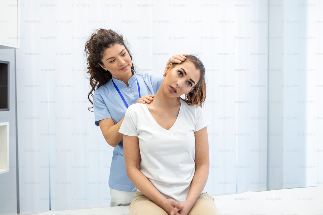 Chiropractor treating a patient in a modern clinic — AI blog writer for chiropractors