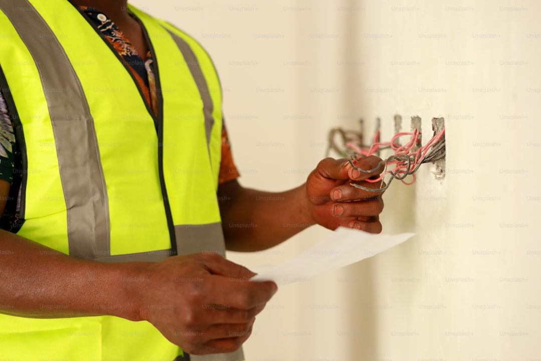 Electrician working on electrical wiring — AI blog writer for electricians