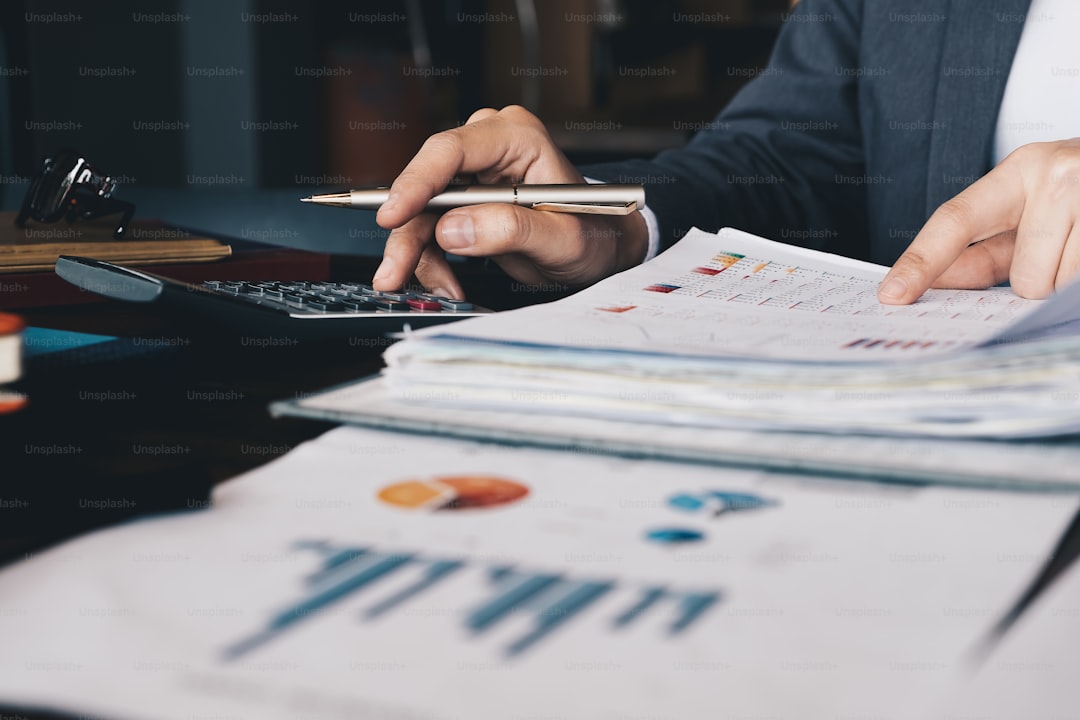 Financial advisor meeting with client in professional office — AI blog writer for financial advisors