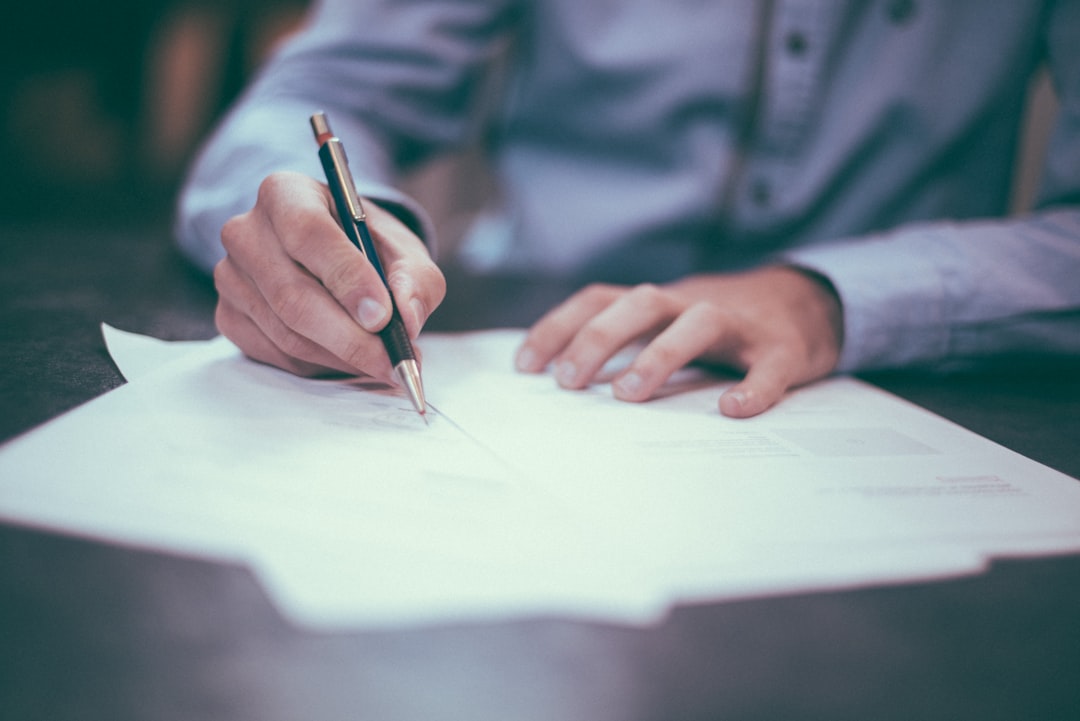 Writer editing content at desk to make AI blog posts sound natural