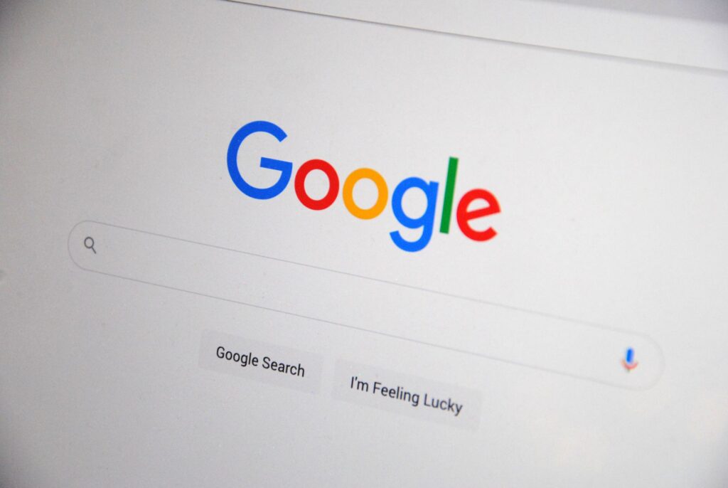 Google search homepage displayed on a screen, representing Google's official policy on AI-generated content and SEO