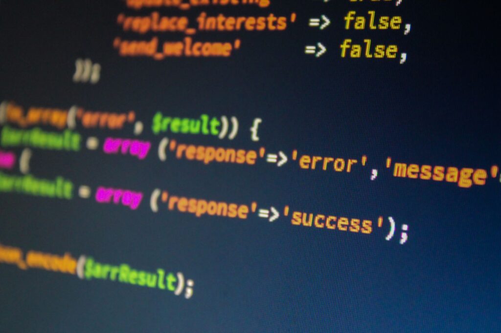 PHP code showing array response with error and success keys, illustrating how the WordPress REST API handles term assignment responses
