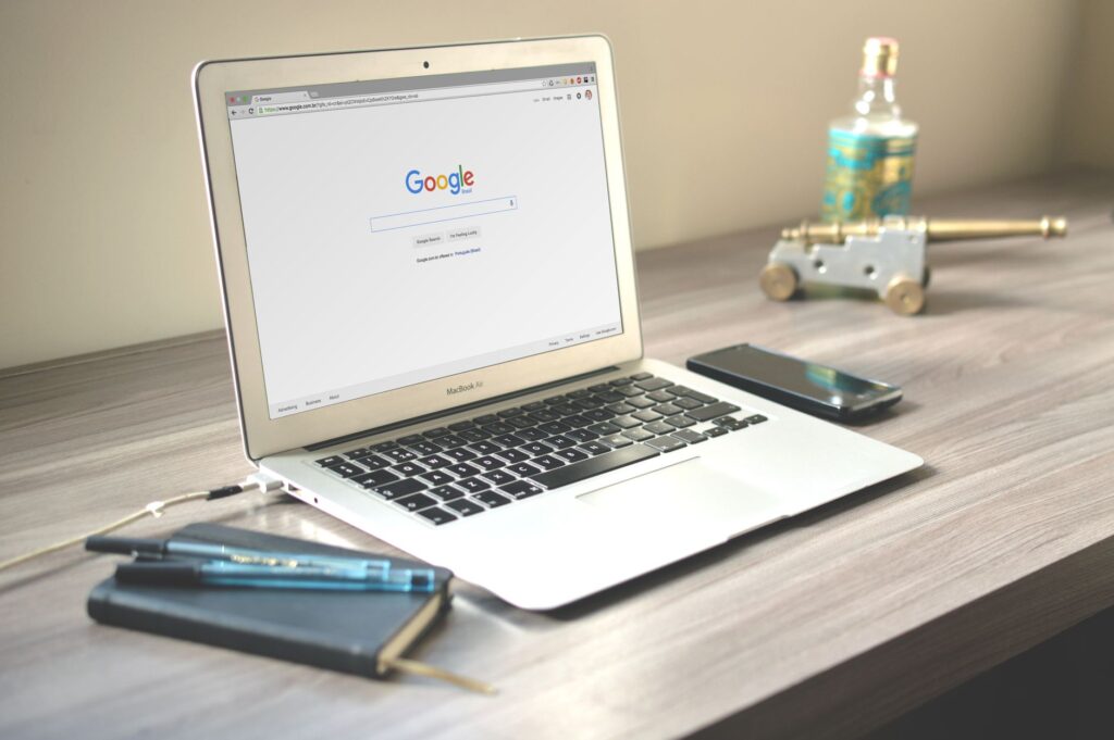 Laptop displaying Google search results on a desk representing local SEO for plumbers