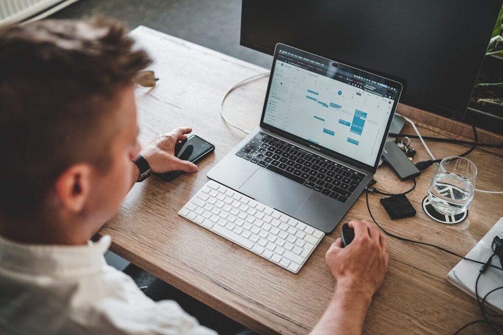 Small business owner reviewing analytics dashboard on laptop — the typical pattern of checking rankings without a clear action plan