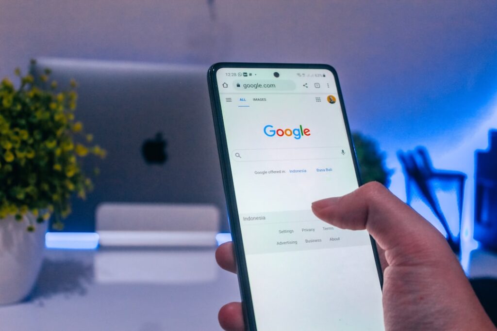 Person searching for a local orthodontist on Google using a smartphone