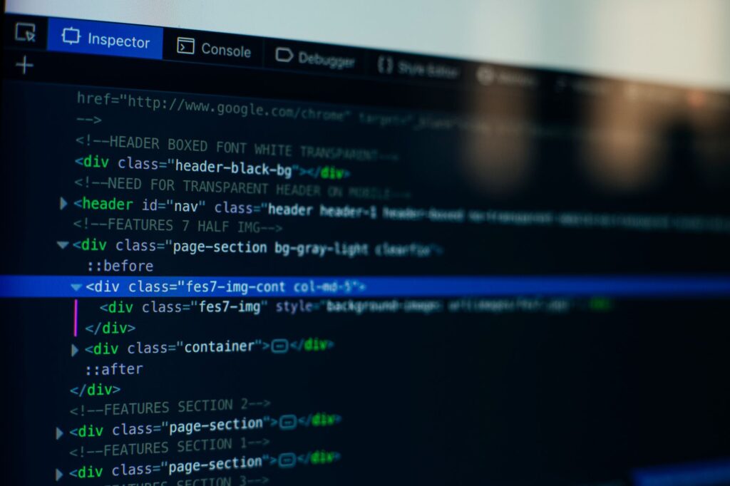 Browser Inspector panel showing HTML source code with div tags and class attributes, used to verify title tags and meta descriptions