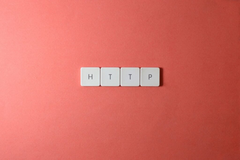 HTTP spelled with white keyboard keys on a pink background, representing HTTP requests and cross-origin resource sharing