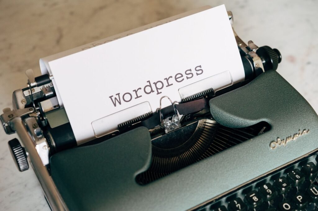 Vintage typewriter with WordPress typed on paper, representing the gap between Frase and native WordPress publishing