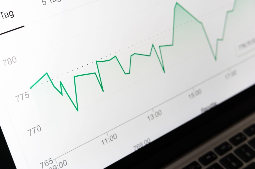 Close-up of a screen showing a green line graph with a sudden upward step change in data