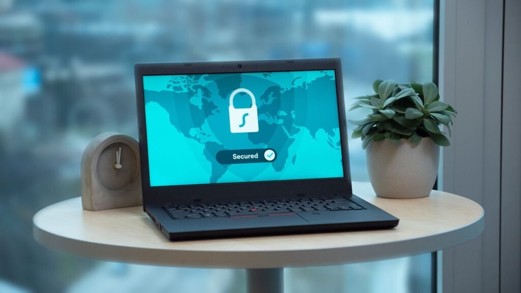 Laptop displaying a security lock icon and Secured status on screen, representing web security and CORS access control