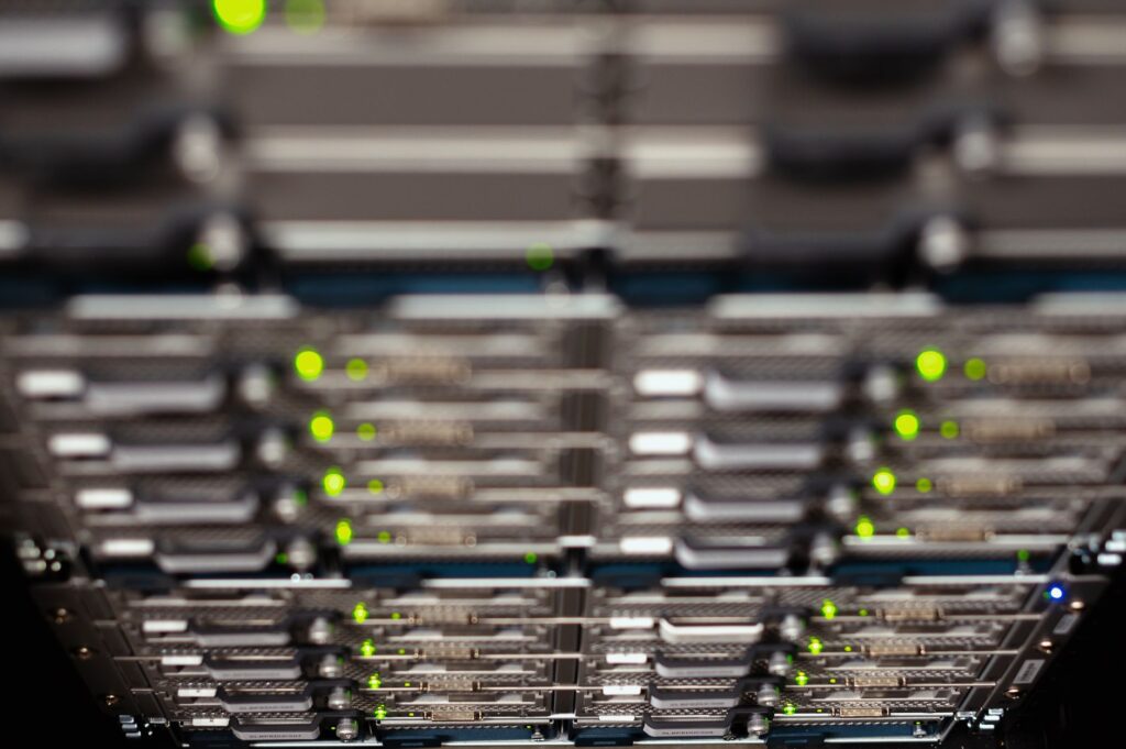 Server rack with green status LEDs in a data center, representing the server infrastructure that wp-cron depends on