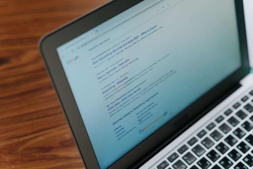 Laptop displaying Google search results page, representing how search engines crawl sitemaps and index website pages
