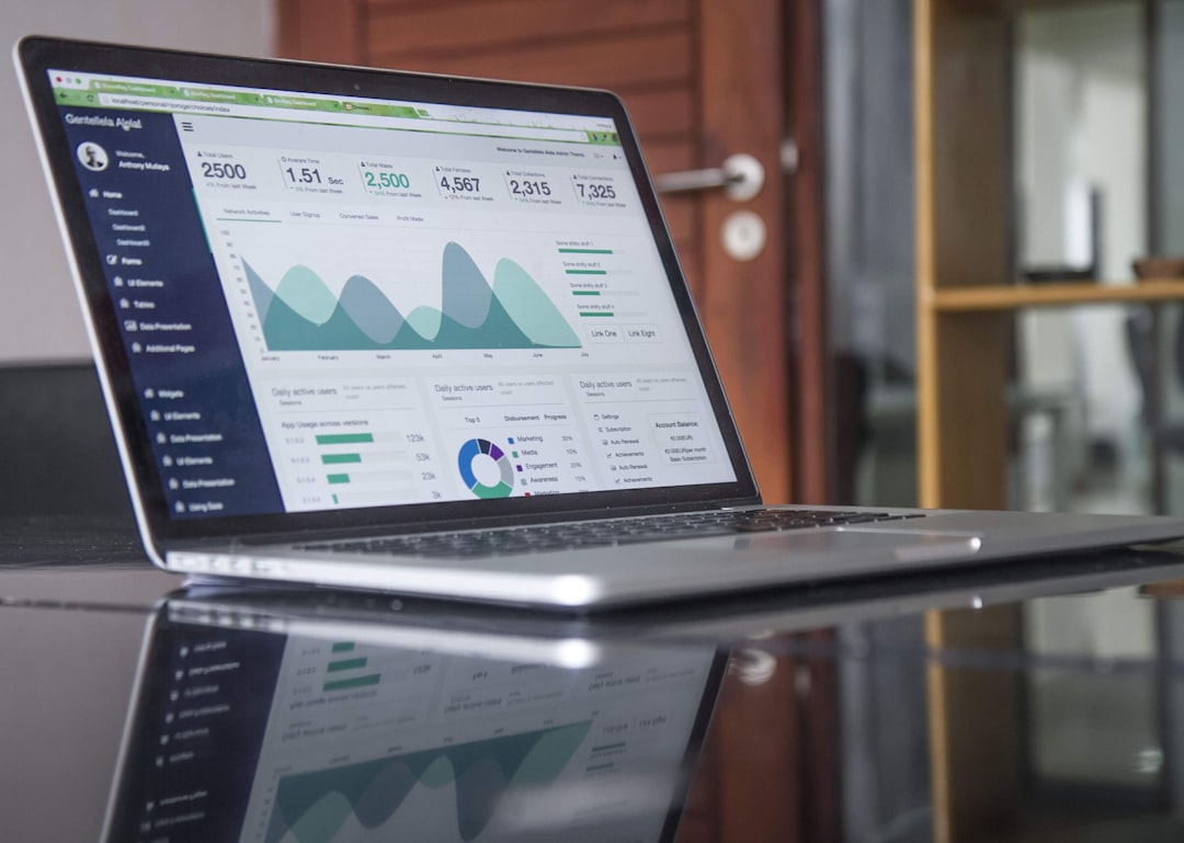 Analytics dashboard on laptop screen illustrating ContentBot pricing and cost-per-article analysis. Photo by Lukas on Unsplash.