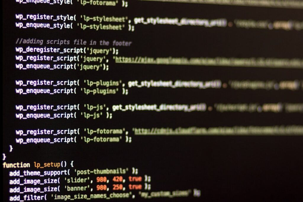 WordPress PHP code displayed on a dark monitor screen showing server-side functions