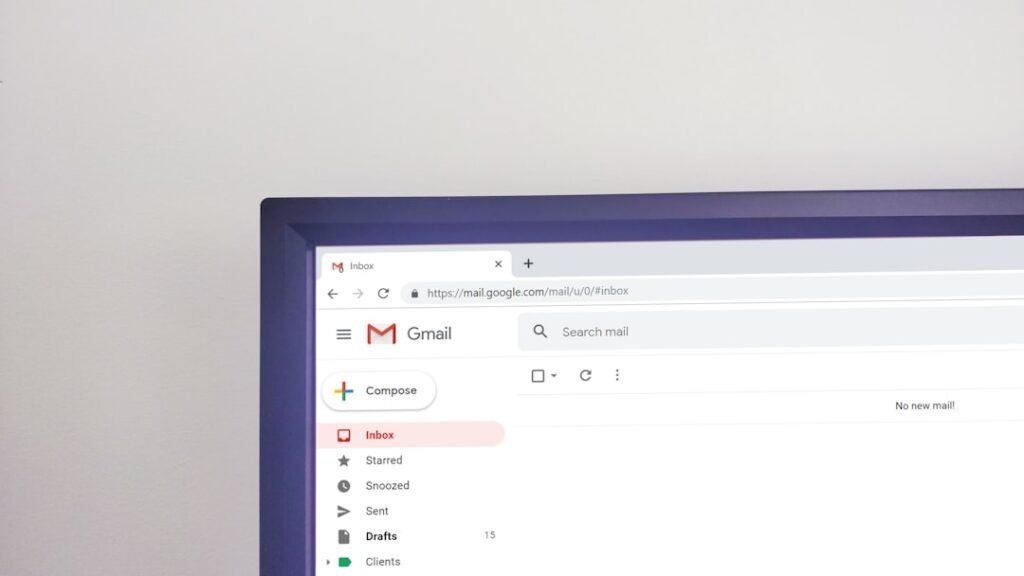 Gmail inbox open on a large monitor, representing email marketing personalization and campaign management