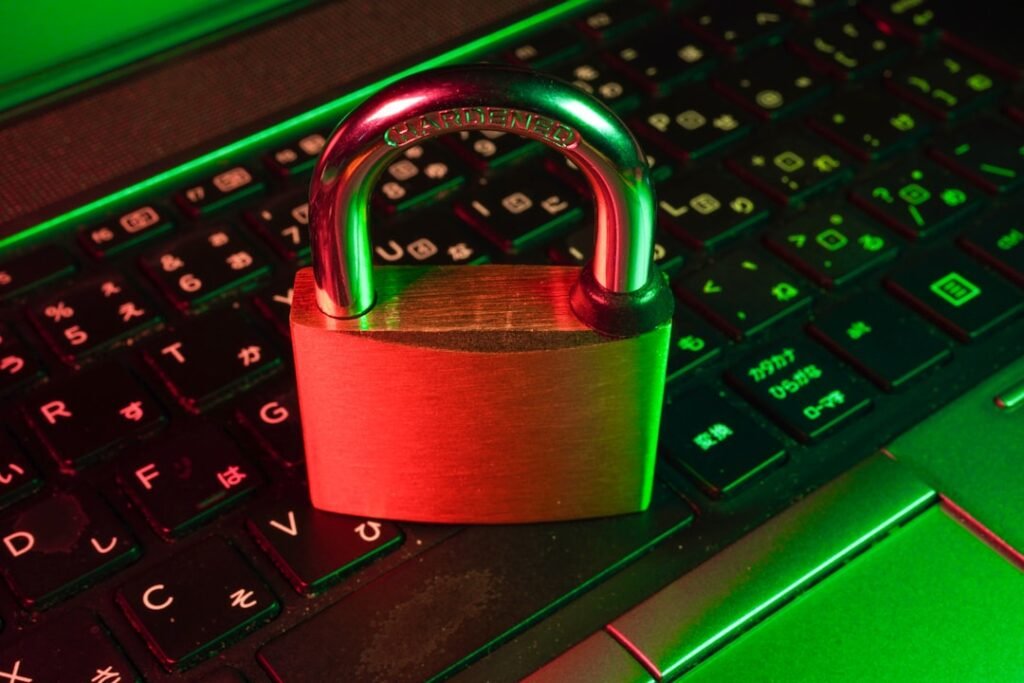 Padlock on a glowing green and red keyboard representing web application firewall security blocking REST API requests