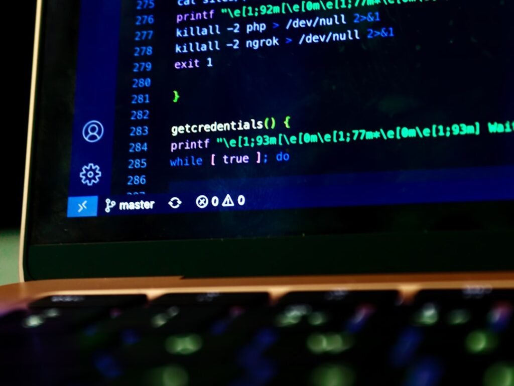 Terminal bash script running on a laptop screen, representing Linux server command line work to fix directory permissions on wp-content/uploads