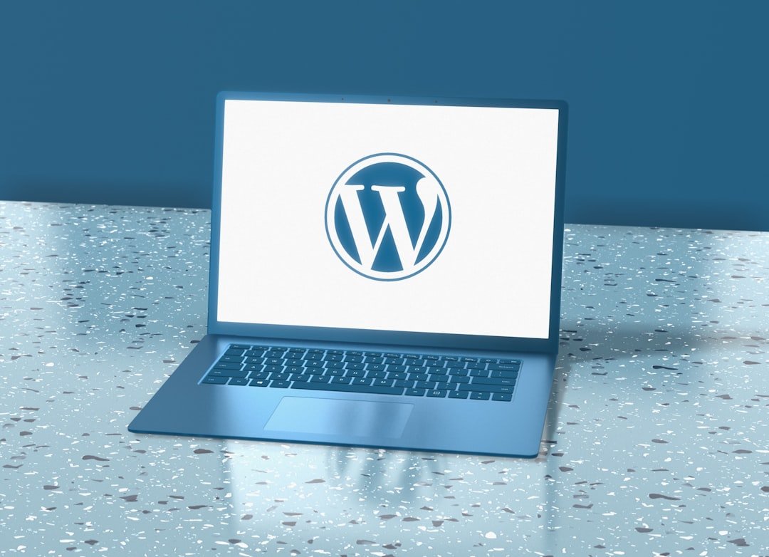 Blue laptop displaying the WordPress logo, representing WordPress REST API authentication