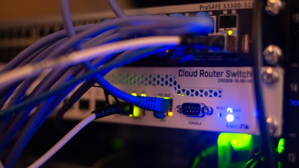 A cloud router switch with ethernet cables connected, representing reverse proxy and network infrastructure relevant to SSL termination