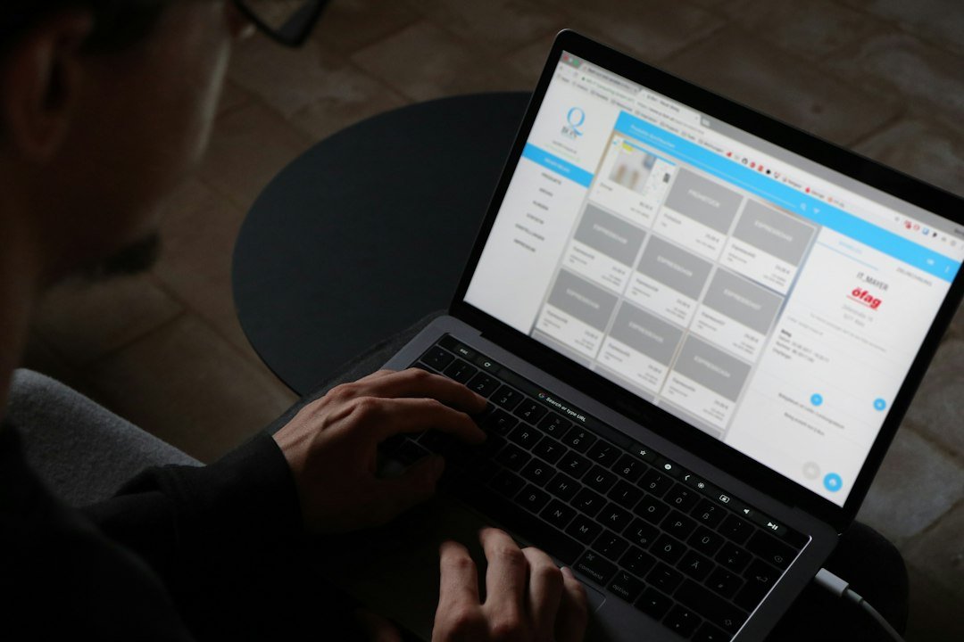 Person reviewing a content management dashboard on a laptop, representing the human approval workflow for AI-assisted content