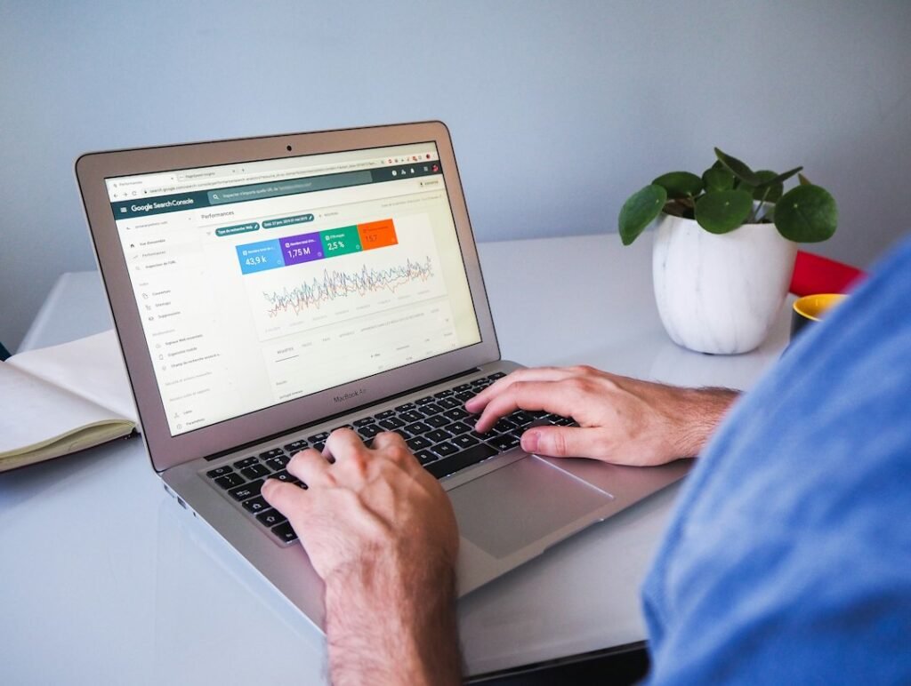 Person reviewing Google Search Console analytics data on a laptop, representing the use of primary source data and citations in SEO content