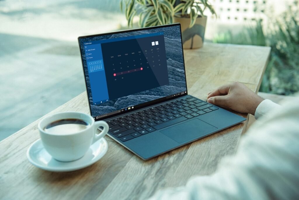 Person working on a clean analytics dashboard on a laptop at a café table with coffee