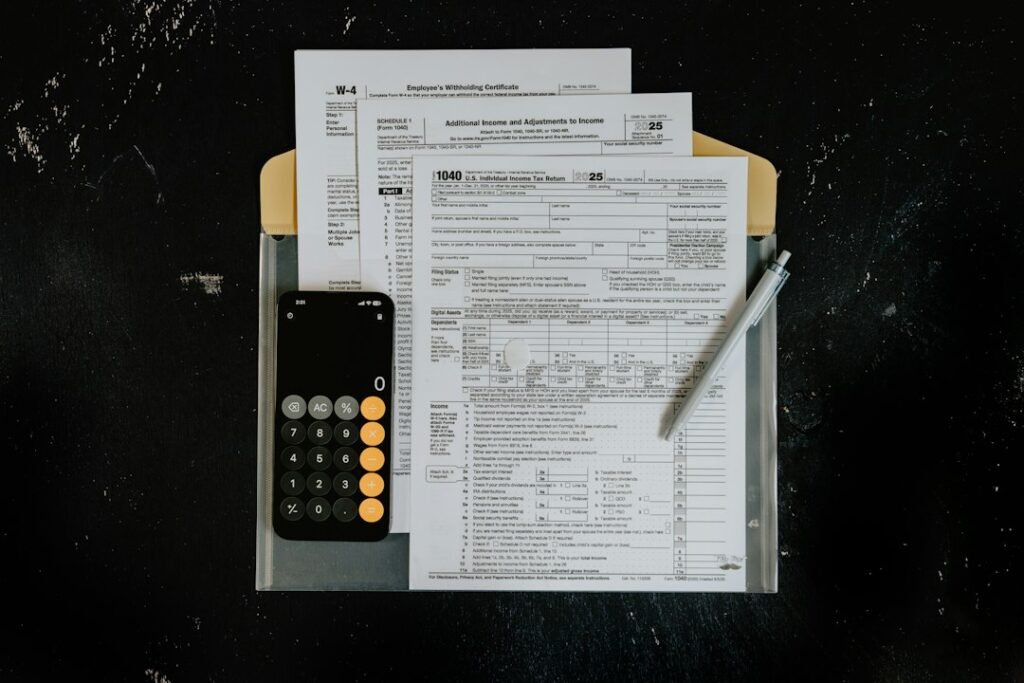 Tax forms and calculator on a dark surface representing the hidden billing costs lurking inside Semrush subscriptions
