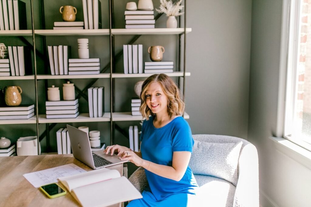 Small business owner working on a laptop at a desk, planning content workflow and marketing strategy